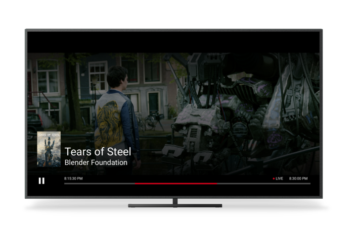 一台电视，显示 Chromecast 的“直播”界面第 8 个场景（含时钟时间）