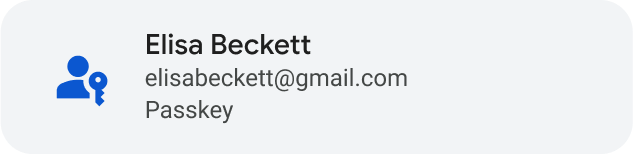 Bouton gris avec une icône générique représentant un humain bleu et une clé à gauche, et &quot;Elisa Beckett&quot; à droite, suivi de son adresse e-mail et du mot &quot;Passkey&quot; (Clé d&#39;accès)