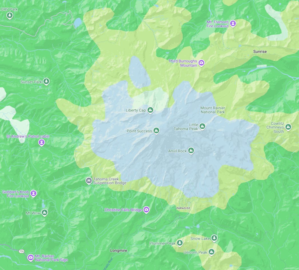 Wyraźna mapa przedstawiająca mapę z górą Rainier na niebiesko, w otoczeniu zieleni parku