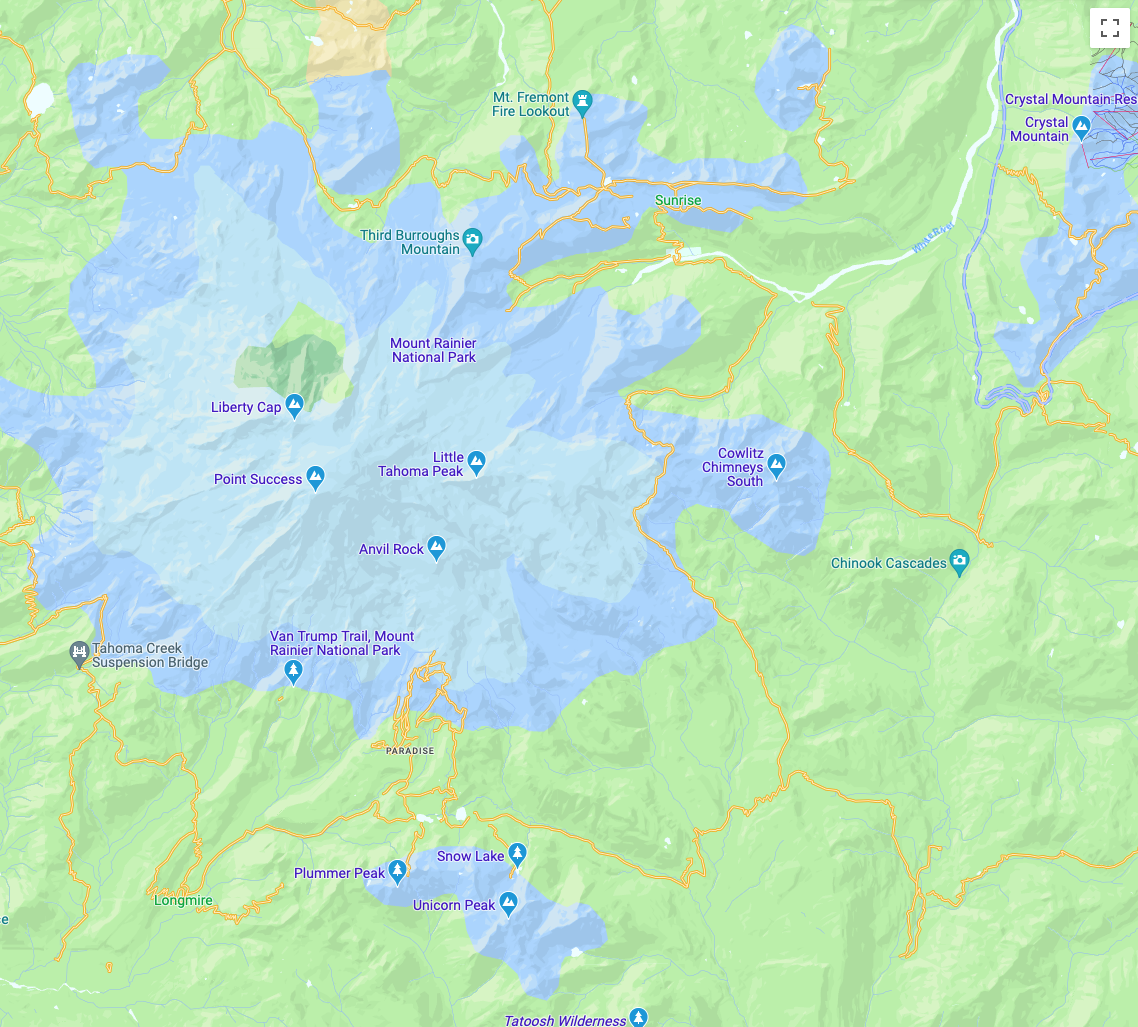 Peta ekspresif yang menampilkan peta dengan Gunung Rainier dalam warna biru yang dikelilingi taman yang hijau